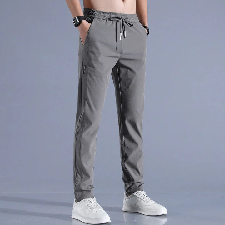 Modern fit men's golf pants, performance wear, combining style and freedom of movement for golf.