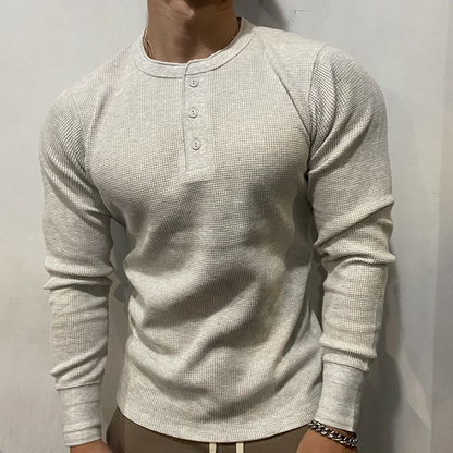 Stylish men's Henley muscle fit shirt, perfect activewear for workouts or a casual, modern athletic look.