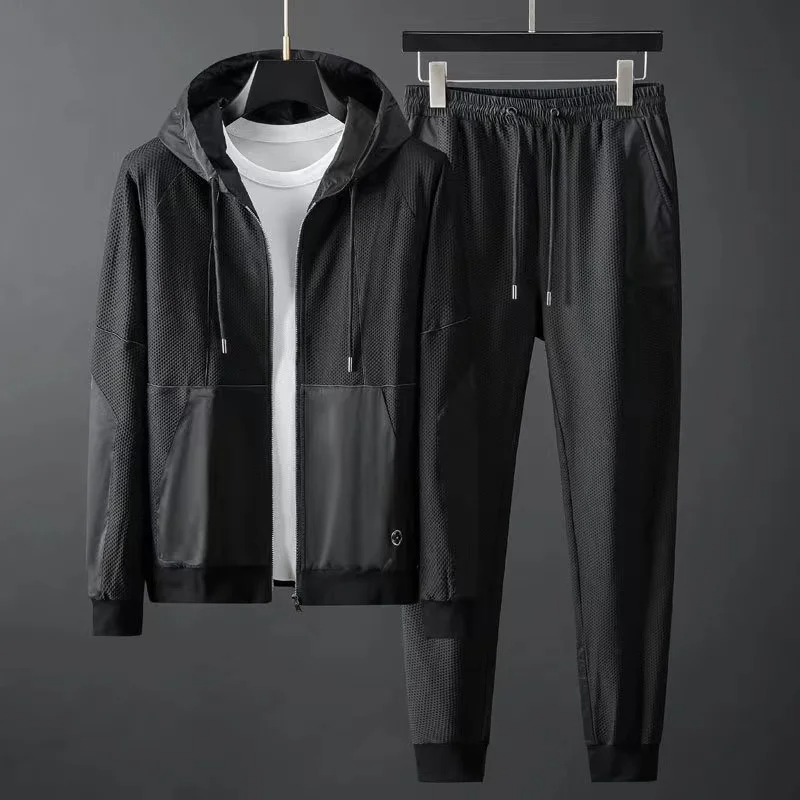 Modern style men's casual tracksuit. Comfort fit hoodie & tapered joggers set for everyday techwear fashion.