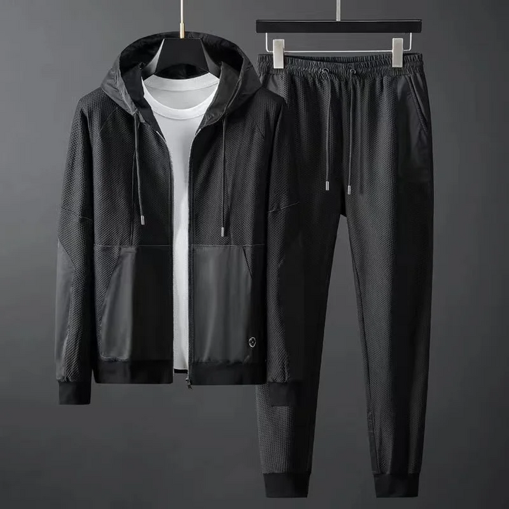 Modern style men's casual tracksuit. Comfort fit hoodie & tapered joggers set for everyday techwear fashion.