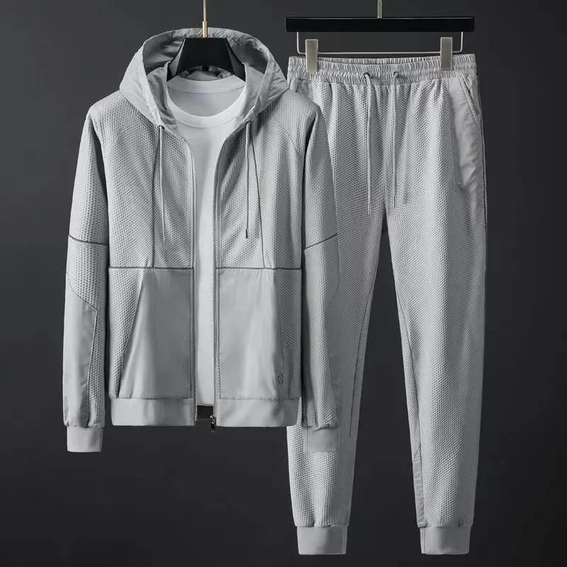 Men's techwear hoodie and tapered joggers set. Performance sportswear for ultimate comfort & modern style.