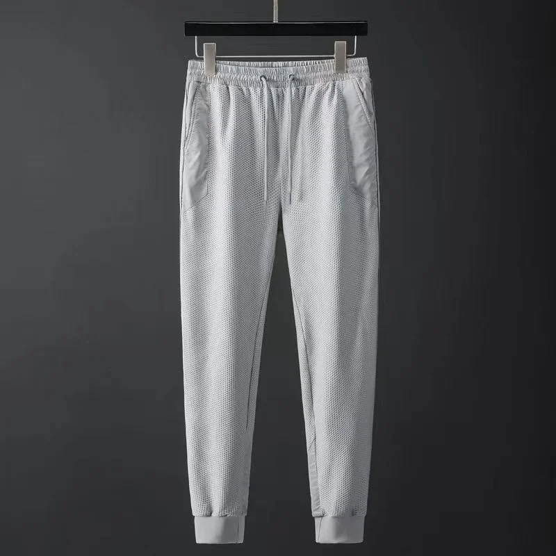 Men's performance hoodie & tapered joggers. Modern techwear tracksuit set designed for comfort & athletic style.