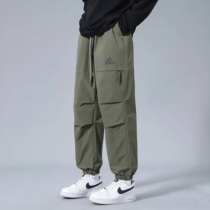 Tapered fit men's performance joggers. Comfortable, flexible activewear pants with cuffed ankles for athletic style.