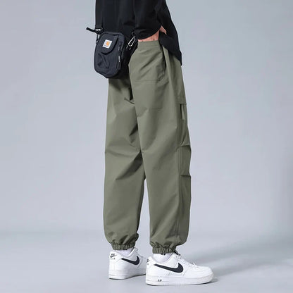 Man wearing comfortable & flexible men's utility joggers, perfect for active lifestyles & casual everyday wear.