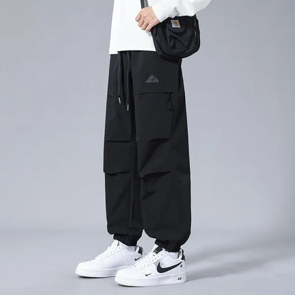 Close-up of secure zippered pockets on men's performance utility joggers, ideal for storing essentials on the go.