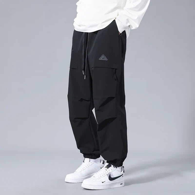 Stylish men's tapered fit joggers with cuffed ankles & practical cargo pockets, great for gym or casual outings.