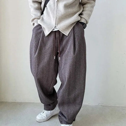 Gray pinstripe men's pants with drawstring waist, offering a relaxed fit for smart casual and everyday comfort.