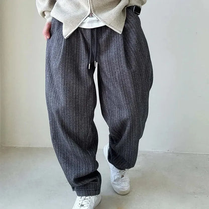 Brown pinstripe drawstring pants for men, designed for a comfortable, relaxed fit perfect for casual wear.