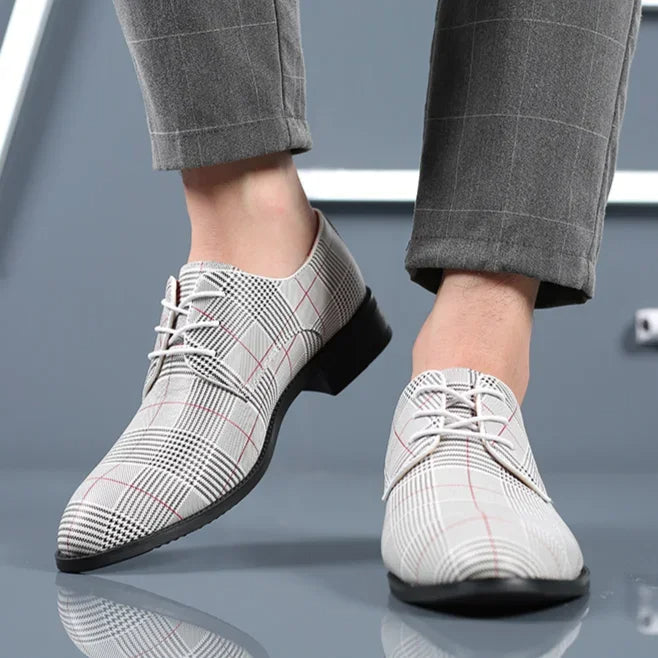 Lace-up men's oxford shoes featuring a unique plaid pattern, perfect for formal wear.