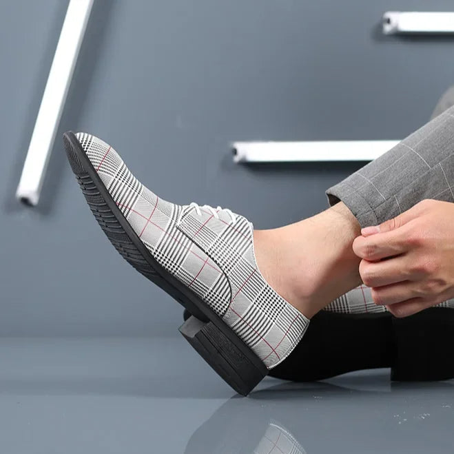 Professional men's footwear: stylish plaid oxford dress shoes for a sharp business outfit.