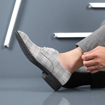 Professional men's footwear: stylish plaid oxford dress shoes for a sharp business outfit.