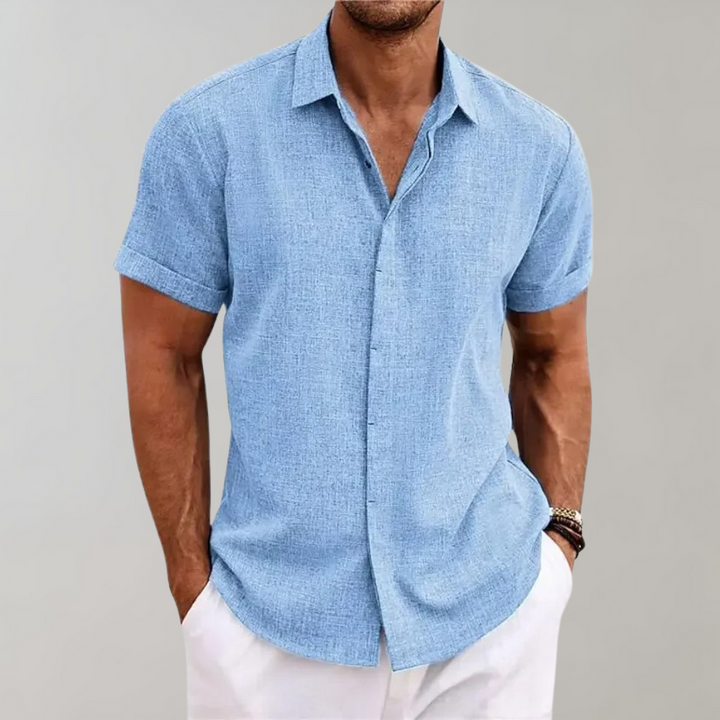 Man wearing a plain Dante polo shirt. Smart casual, versatile men's fashion, perfect summer top, short sleeve.
