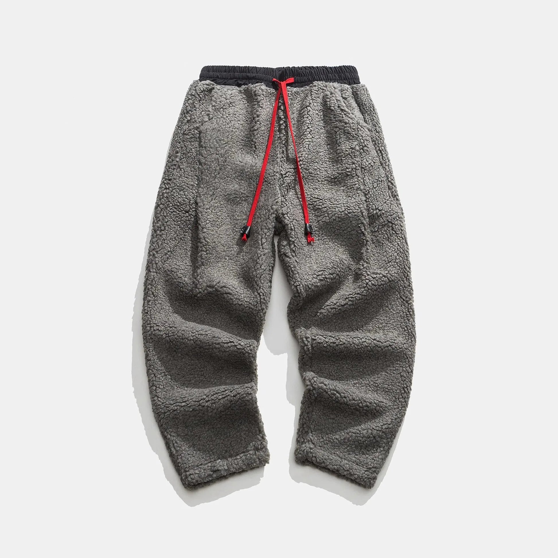 Men's plush sherpa fleece joggers with pockets, warm, comfortable, and practical winter loungewear.