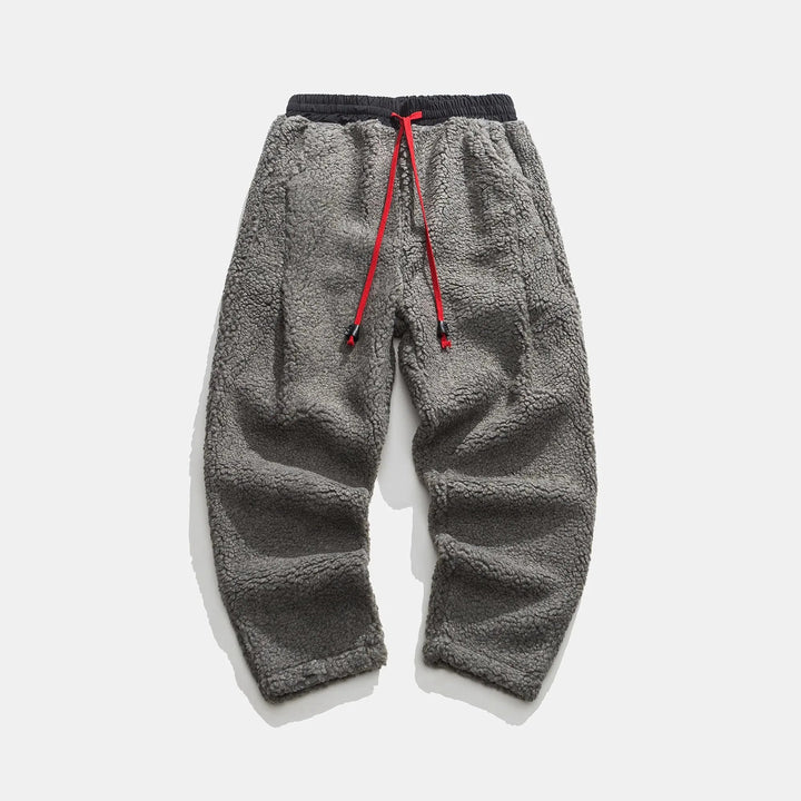 Men's plush sherpa fleece joggers with pockets, warm, comfortable, and practical winter loungewear.