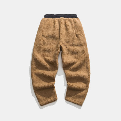 Elastic waistband & ribbed cuffs on men's plush sherpa fleece jogger pants, warm winter loungewear.