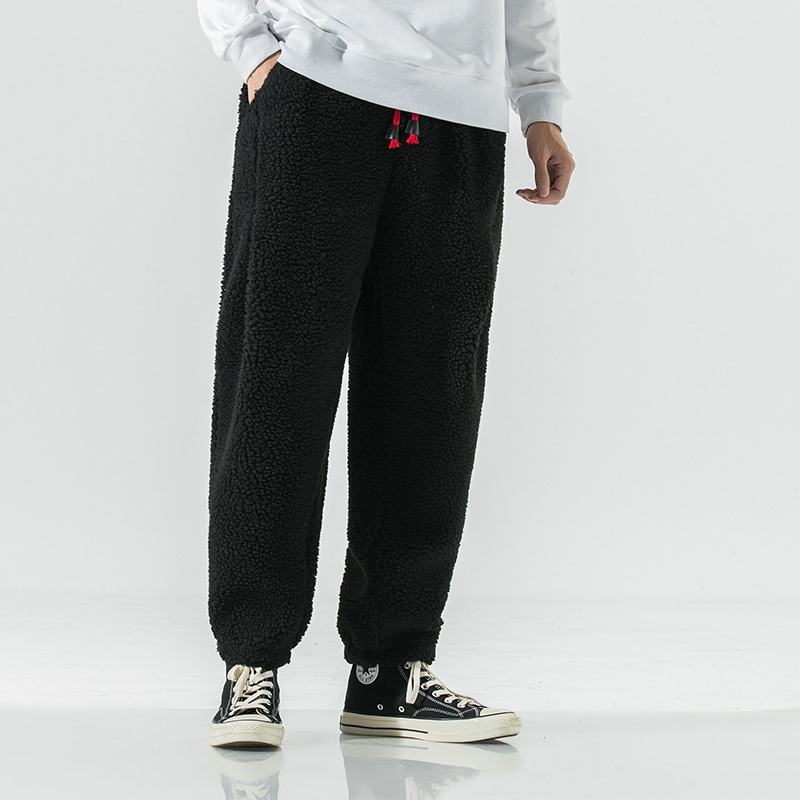 Men's plush sherpa fleece joggers, ideal warm winter pants for casual wear and cozy loungewear comfort.