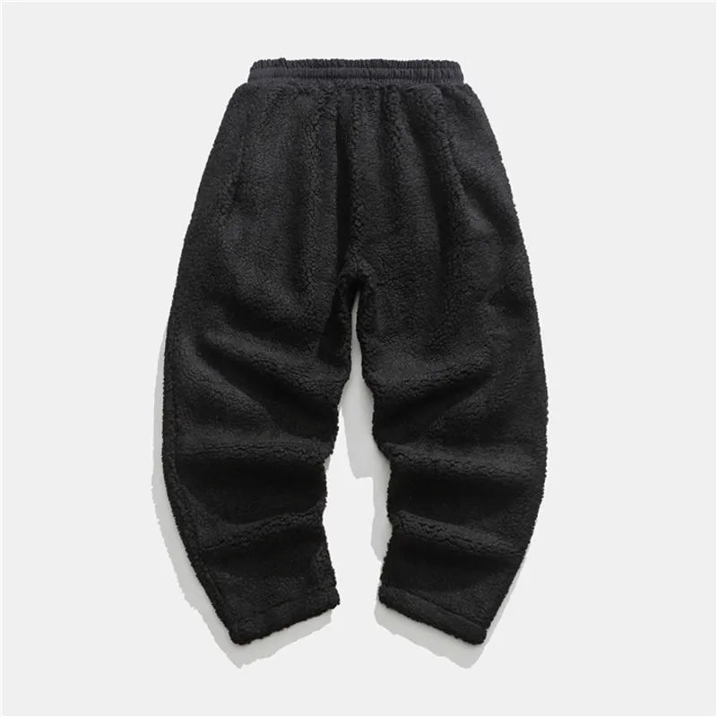 Versatile men's plush sherpa fleece joggers for casual wear, athletic lounging, or warm winter comfort.