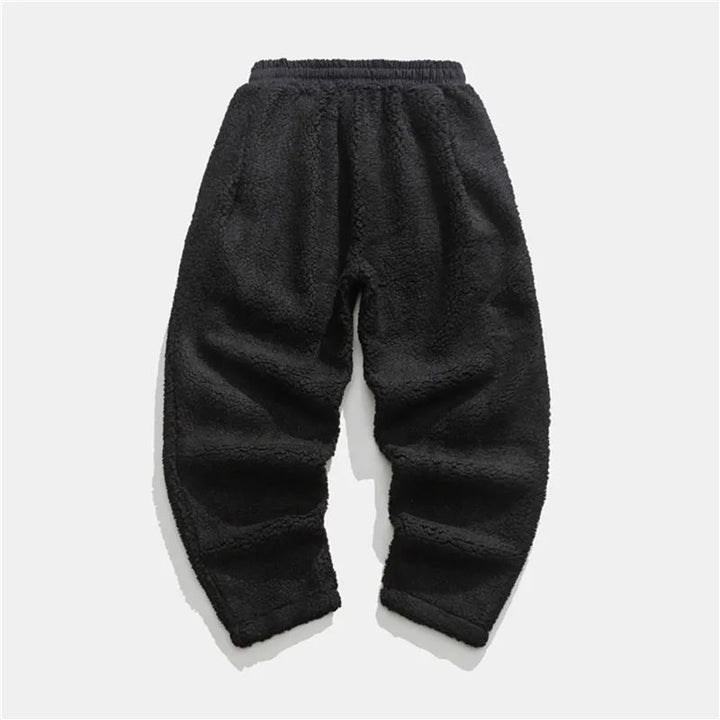 Versatile men's plush sherpa fleece joggers for casual wear, athletic lounging, or warm winter comfort.