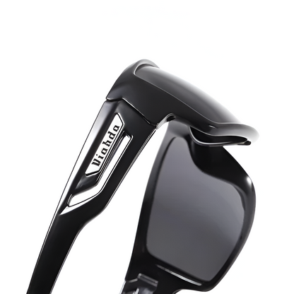 Man actively fishing wearing polarized UV400 anti-glare tactical sunglasses for clear outdoor vision. Durable sports gear.