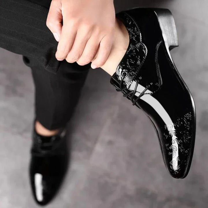 High-quality men's black polished lace-up dress shoes. Classic style formal footwear for a timeless, elegant look.