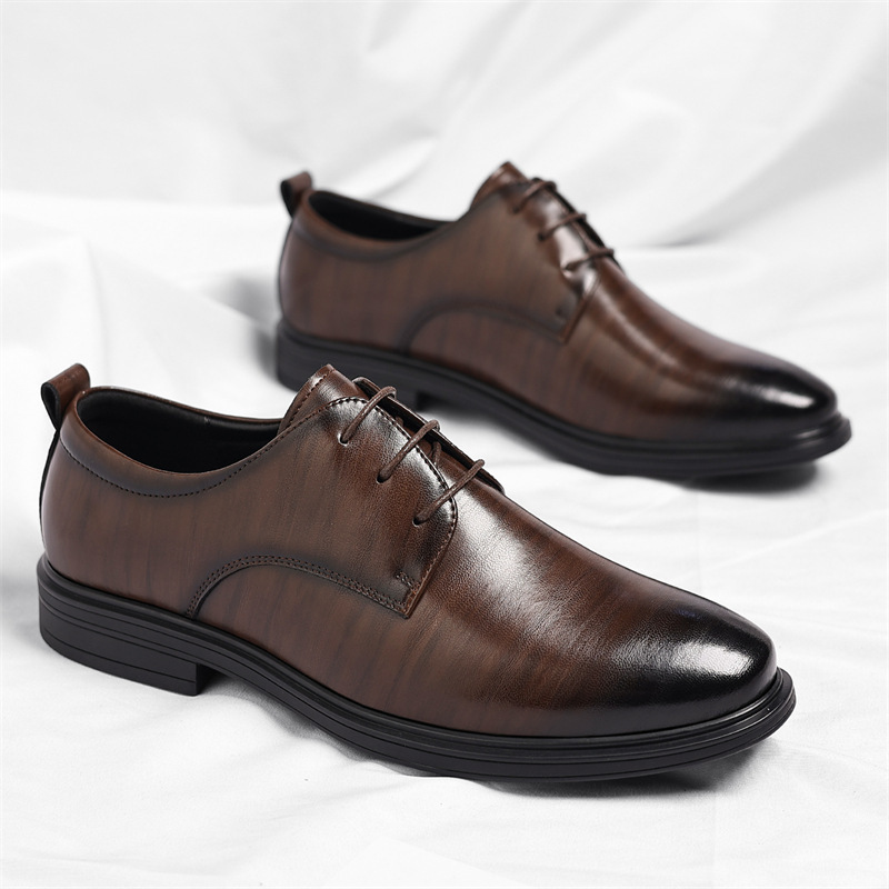Close-up of elegant men's black leather formal shoes, showcasing classic style & polished finish.