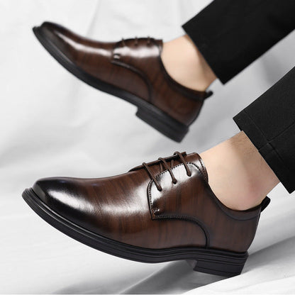 Polished black leather men's business shoes, offering classic style and elegant professional footwear.
