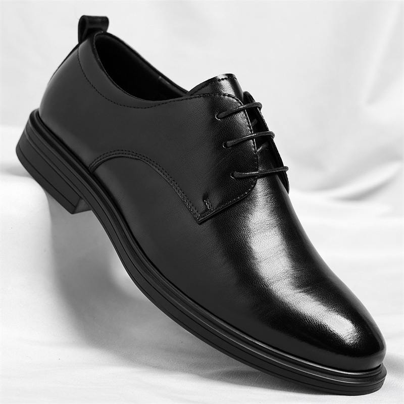 Side view of men's sleek black polished dress shoes, perfect for professional & formal occasions.