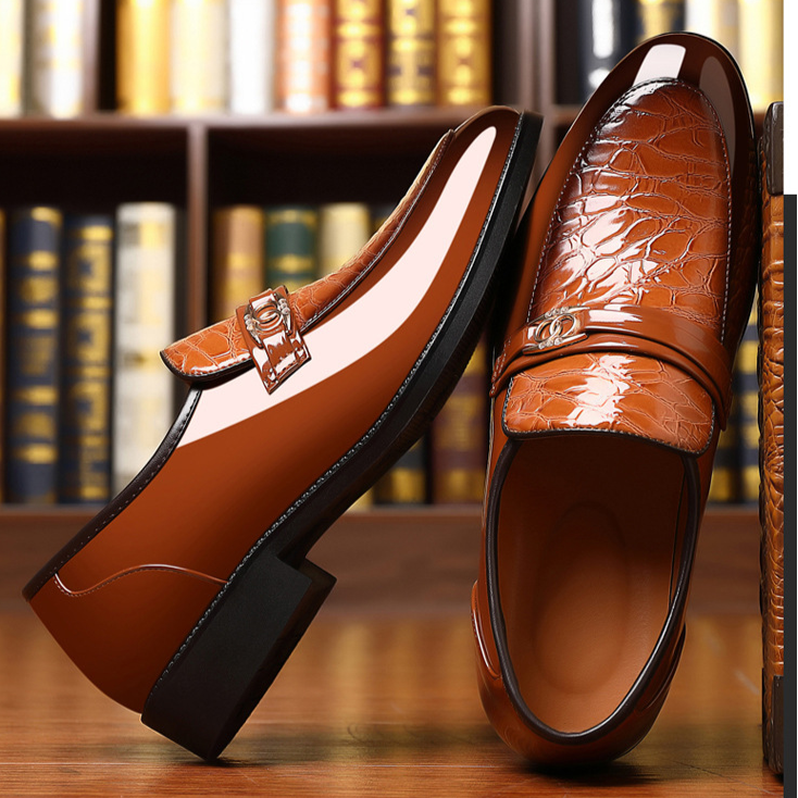 Men's fashion essential: polished black slip-on dress loafers with distinctive croc pattern.