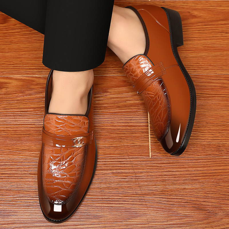 Croc-textured men's slip-on loafers with a polished finish and striking gold accent.