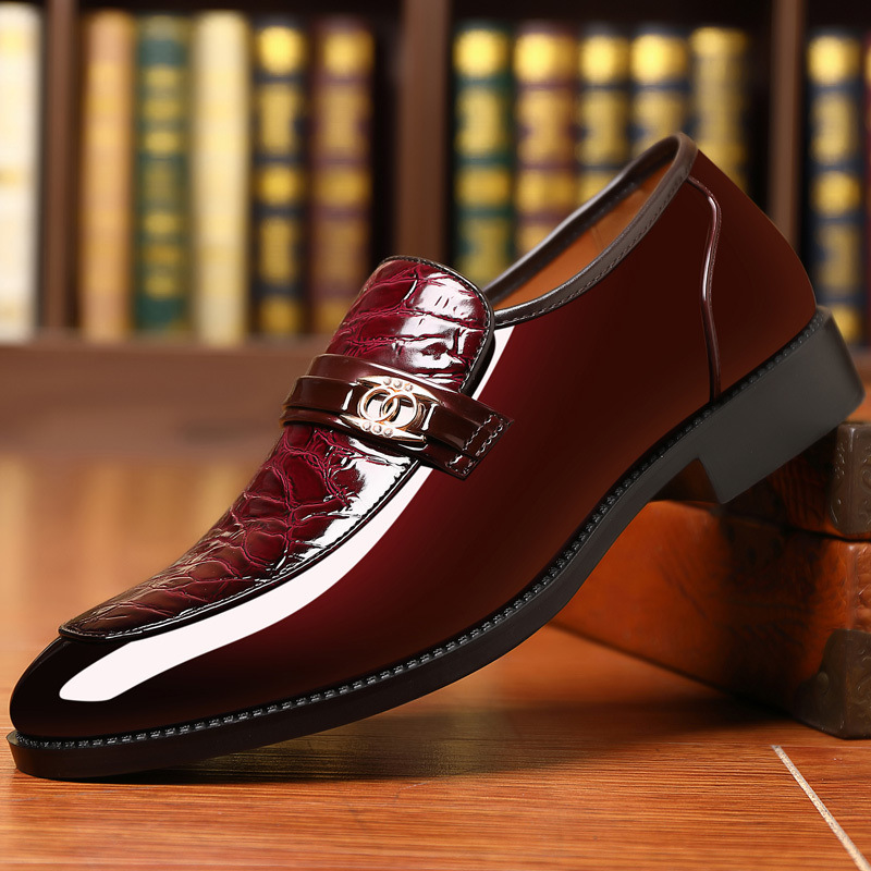 Polished men's dress loafers with sophisticated croc texture and shiny gold accent.
