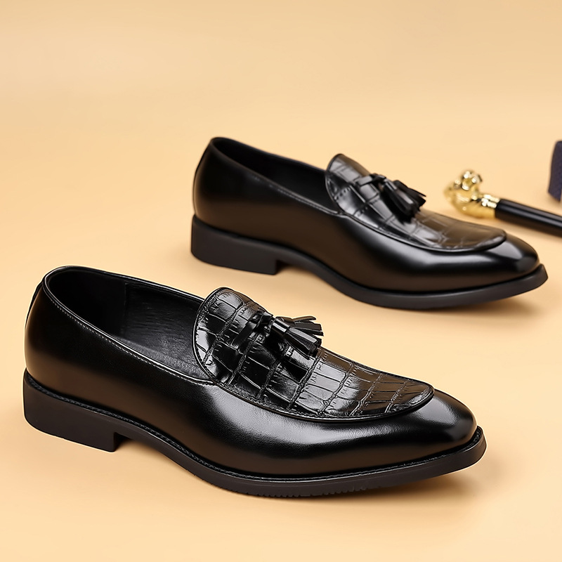 Classic men's brown polished tassel loafers; elegant slip-on dress shoes for a sharp, confident look.