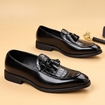 Classic men's brown polished tassel loafers; elegant slip-on dress shoes for a sharp, confident look.