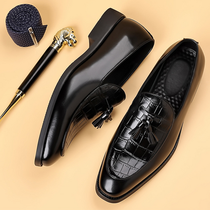Comfortable men's polished leather tassel loafers; elegant slip-on formal shoes for classic style.