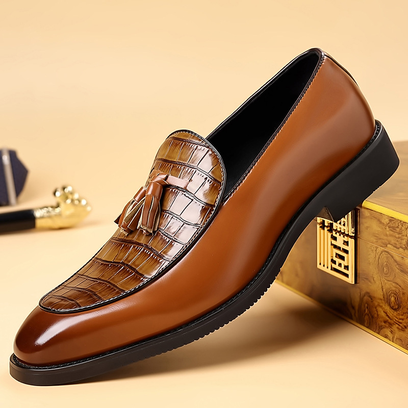 Men's classic slip-on tassel loafers with a polished finish; comfortable and stylish dress shoes.