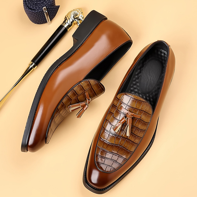 Sophisticated men's brown polished leather tassel loafers; comfortable formal dress shoes for a classic style.