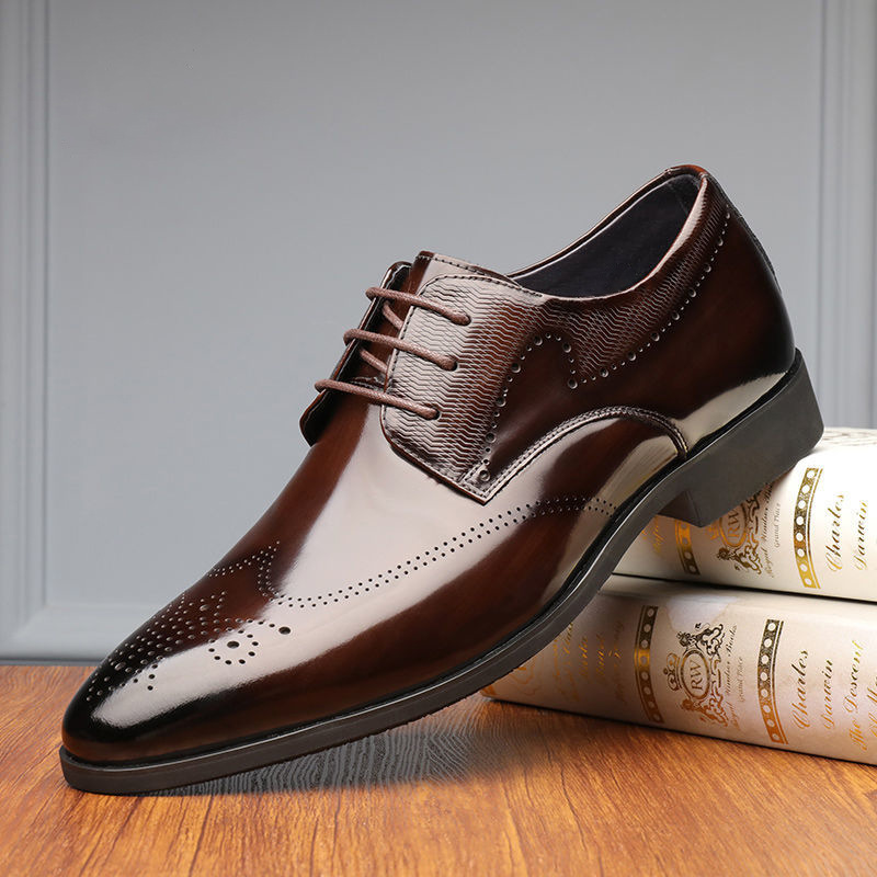 Men's polished brown leather brogue dress shoes with classic lace-up design for sophisticated formal style.