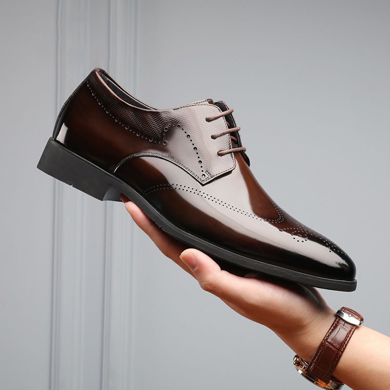 Classic men's polished leather brogue dress shoes, featuring intricate detailing & comfortable fit.