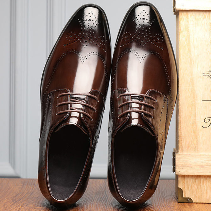 Side view of polished dark brown men's brogue dress shoes, ideal for a refined business casual outfit.
