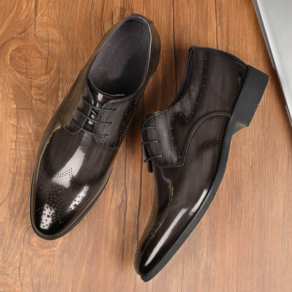 Stylish men's polished brogue footwear with intricate perforations, perfect for professional or formal wear.