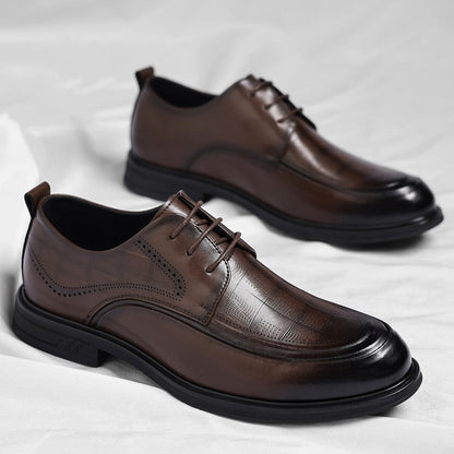 Close-up of sleek men's polished brogue dress shoes with classic perforations for a refined look.
