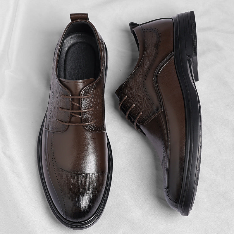 Stylish men's black polished brogue dress shoes, perfect for professional office wear and formal attire.