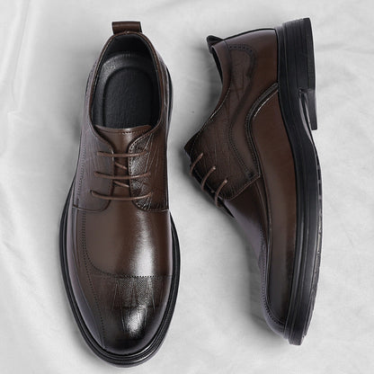Stylish men's black polished brogue dress shoes, perfect for professional office wear and formal attire.