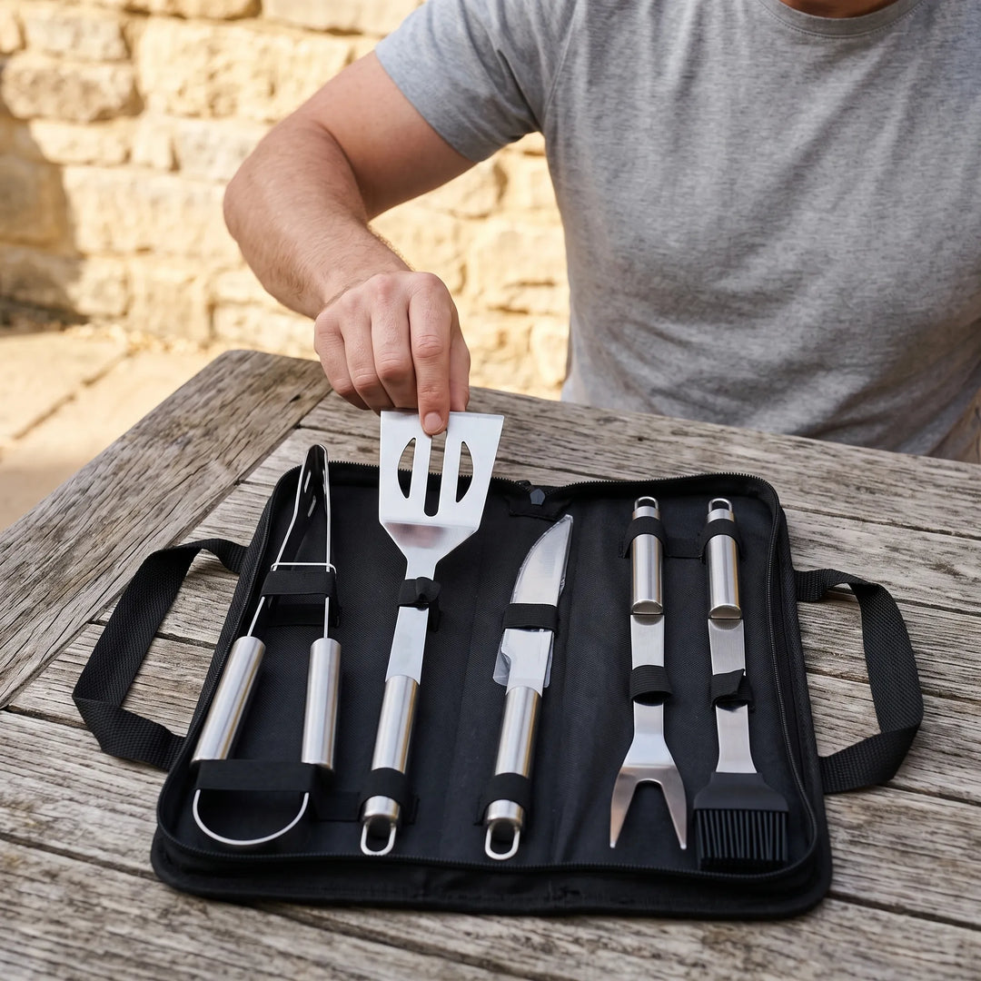 Men's portable BBQ grilling tool set with stainless steel utensils, perfect for outdoor cooking & camping.