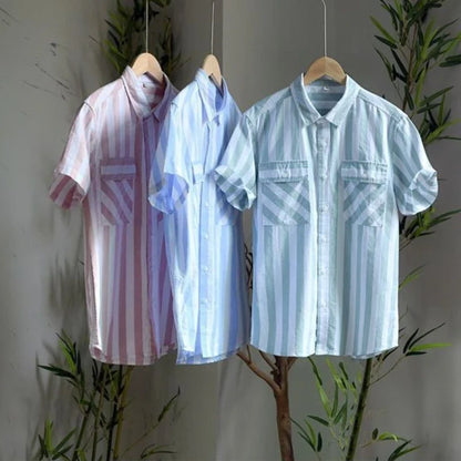 Tailored men's short-sleeve button-up shirt with classic stripes & chest pocket. Perfect for resort and vacation wear.