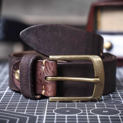 Men's durable brown cowhide leather belt, a classic vintage style accessory perfect for casual outfits.