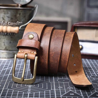 Rich texture of a men's durable cowhide leather belt in brown. A timeless leather accessory for lasting style.