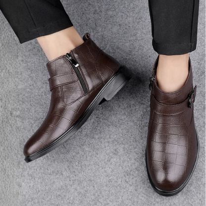 Black full-grain leather men's casual boots with secure side zipper & adjustable buckle. Durable and comfortable.