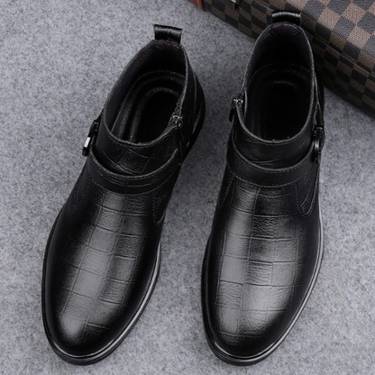 Modern men's stylish leather boots with distinctive zipper and buckle accents, suitable for any occasion.