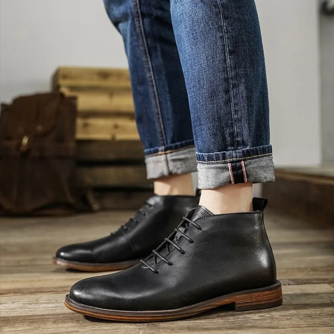 Durable sole of men's premium brown leather dress boots, designed for comfort, traction & longevity.