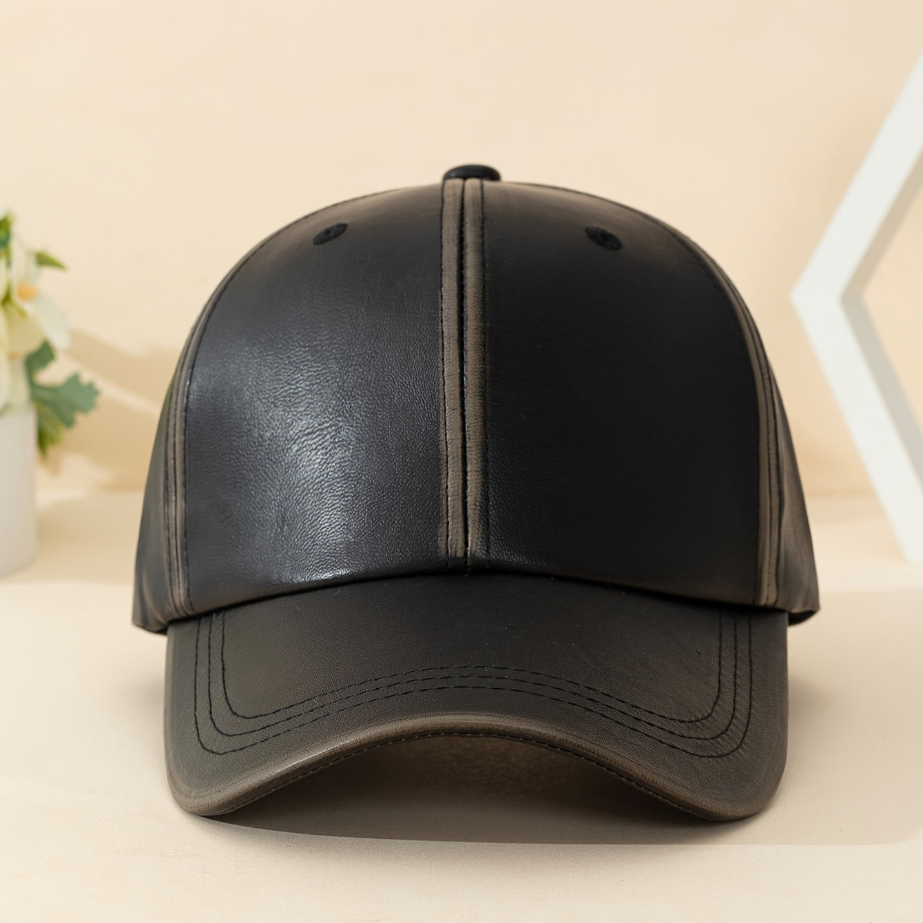Men's classic black leather hat, a timeless and rugged accessory for enduring style.